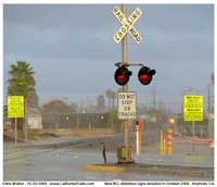 Just after the arrival of the first RCL platform units at West Anaheim, these yellow signs seemingly sprouted out of the ground all along the line. First photo is looking east across Lincoln Ave.
