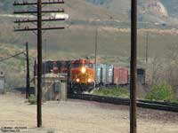 BNSF 5498 pulling a mixed manifest train passed the Cajon sign.
