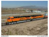 Two new Gevos with BNSF's "New Image" logo pull passed the Cargil facility as seen from Cargil Hill