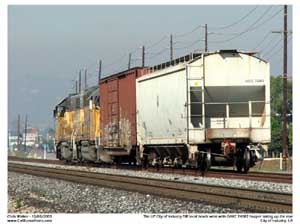 UP 362 passing with a boxcar and covered hopper enroute back to the yard 