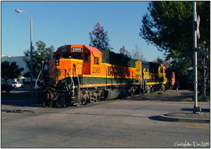BNSF 2365 crossing Valencia as they make a run around their train to reposition the caboose.