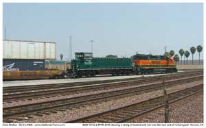 BNSF 2736 and a Green Goat RRPX 2405 shove a section of this stack train back into the east end of Hobart yard.