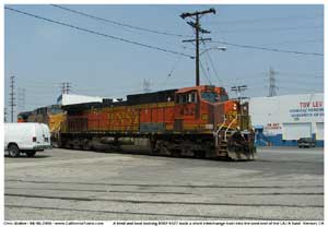 * A battered and primered BNSF 4321 is seen here bringing the M-BARLAC onto the LAJ A yard lead wit a UP engine second in consist.