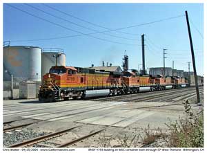 BNSF 4755 takes a stack train north through CP West Thenard next to the Vallero asphalt plant.