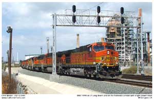 BNSF 4998 travels under the signals at CP Long Beach Jct. heading for Terminal Island