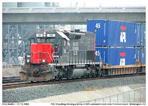 PHL 50 pulls a string of APL loaded well cars towards CP Long Beach Jct.