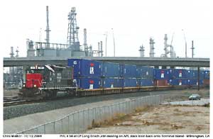 Another image of PHL 50 with a string of APL loaded well cars towards CP Long Beach Jct.