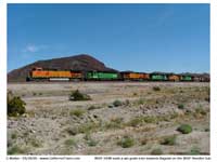 We were made aware of two grain trains heading west and just after passing Bagdad we caught site of the first one. We pulled over on route 66 and all hopped out to get images of this train. The consist could not have been more interesting with it's Orange - Green - Orange arrangment.
