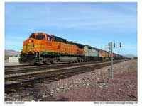 ... We stopped at the grade crossing in the town of Amboy to capture a few more images of the grain train with BNSF 5372 on the point ...