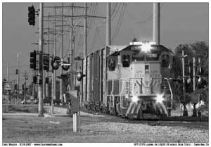 Now done with switching the LA Times, the 32 heads east along Alton Blvd with the 5 empty boxcars. Photographed crossing Bear Street.
